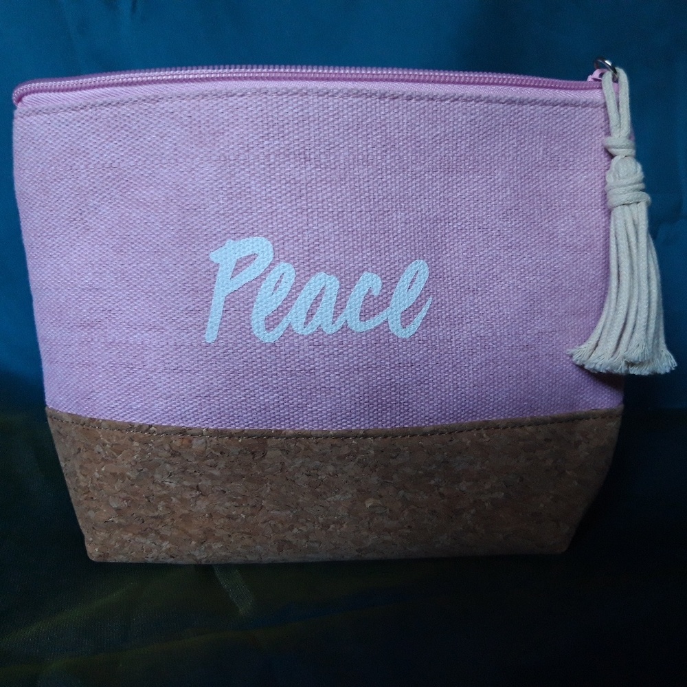 2 for $11. Cosmetic bag. PEACE. NEVER USED
